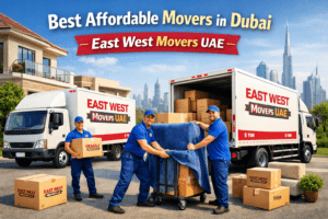 East West Movers UAE professional team loading boxes into 3-ton and 5-ton moving trucks in Dubai, offering best affordable movers for apartment and villa relocation services.