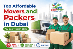 Top affordable movers and packers in Dubai 2026 advertisement featuring East West Movers UAE team, moving truck, packing boxes, and Dubai skyline background.